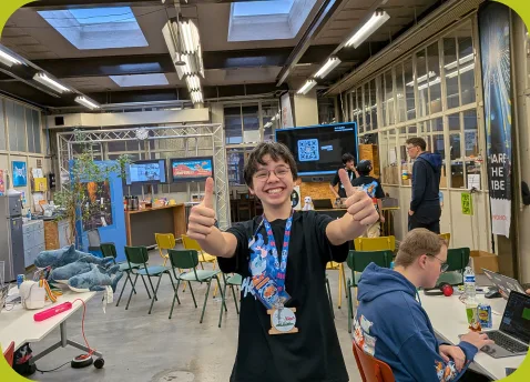 An organizer giving a thumbs up in a booked venue